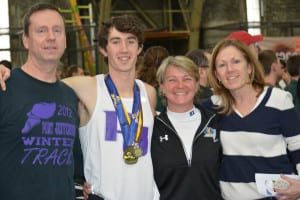 Head coach Rod Cawley, runner James Burke, athletic director Debra Ferry and Burke's mother Maureen pose for a photo. Photo by Jim Burke