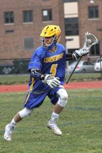 Comsewogue’s Johnny Koebel looks downfield to make a play in the Warriors’ 6-5 win over Hauppauge Tuesday. Photo by Desirée Keegan