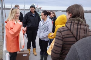 Darcy Lonsdale speaks to students at Lake Ronkonkoma before they take samples. Photo by Phil Corso