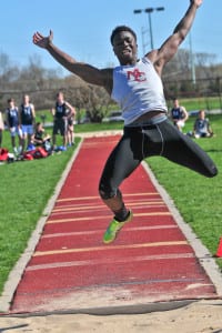 Denzel Williams competes in the long jump for Middle Country. Photo by Bill Landon