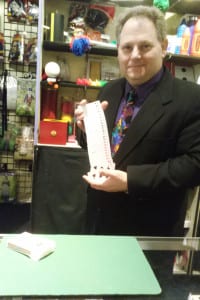 Ronald Diamond performs a card trick at the Ronjo magic shop. Photo by Jenni Culkin