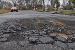 Sands Lane is one street in northern Port Jefferson ready for repaving after a harsh winter beat them up. Photo by Elana Glowatz