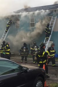 Firefighters douse a blaze that overtook a two-story office building on New York Avenue in Huntington village on Tuesday. Photo from Huntington Fire Department