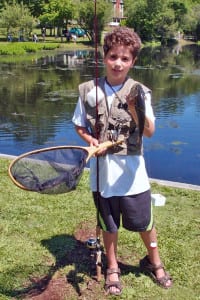 Angelo Lupo with his sixth fish, which garnered him first prize for the most fish caught in the afternoon session of last year’s tournament. Photo from Carole Paquette