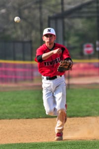 Newfield’s Joe Pepe makes a throw from third to get the runner at first. Photo by Bill Landon