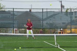 Renee Lemmerman waits on a service at the new Port Jefferson Village tennis courts. Photo by Barbara Donlon