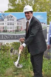Tony Gitto breaks ground at the site of his upcoming apartment complex. Photo by Elana Glowatz