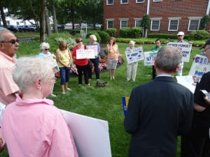 Dream Act advocates congregate outside Sen. John Flanagan's office Thursday in prayer. Photo by Phil Corso