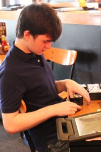 Jacob Robinson learns work skills at Buffalo Wild Wings in Centereach. Photo by Erika Karp