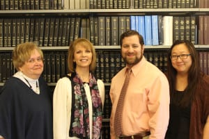 From left, Luise Weiss, Theresa Arroyo, Jim Ward and Sara Fade lead creating the history book. Photo from MCPL