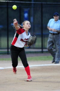 Mount Sinai senior Jessica Parente throws the runner out at first pitch in the Mustangs’ 11-4 loss to Clarke in the Long Island Class A championship on June 5. Photo by Bill Landon