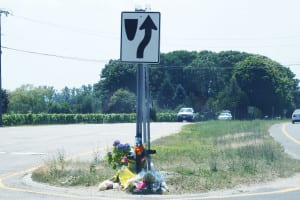 A makeshift memorial is erected at the scene of the fatal Cutchogue crash. Photo by Phil Corso