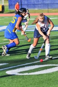 Irina DeSimone maintains possession of the ball in a game against Comsewogue last season. File photo by Bill Landon