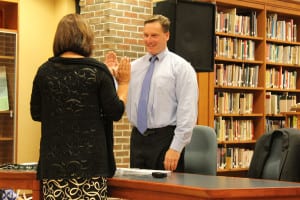 Keith J. Frank is sworn in as Miller Place school board's newest trustee. Photo by Victoria Espinoza