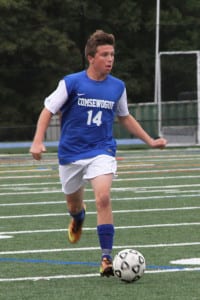 Comsewogue's Trevor Kennedy dribbles up the field. File photo by Desirée Keegan