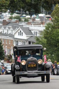An antique car makes its way during the Hill Climb at Port Jefferson's Heritage Weekend. Photo by Bob Savage