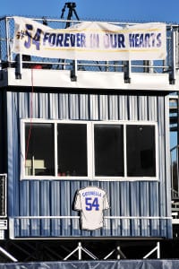 A sign with Tom Cutinella’s jersey number sits above the press box above the soon-to-be old Wildcats athletic field. File photo by Bill Landon