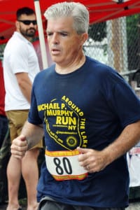 Suffolk County Executive Steve Bellone makes his way down the marathon route in a previous running event held in the county. Photo from Bellone’s office 