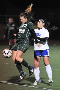 Harborfields' Caroline Axelson stops the ball while Comsewogue's Haley Cooke tried to stop her in her tracks in the Tornadoes' 1-0 win over the Warriors on Oct. 19. Photo by Bill Landon