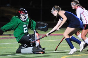 Huntington's Elizabeth Berejka scores on Newfield's Maria Daume in the Blue Devils' 4-2 loss to Newfield on Oct. 16 Photo by Bill Landon