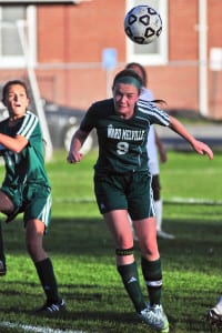 Ward Melville junior midfielder and co-captain Megan Raftery, who had two goals in the Patriots' 6-0 win at Brentwood on Oct. 5, heads the ball. Photo by Bill Landon