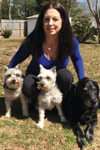 Debra Bauer with her pooches, from left, Cody, Mustang Sally and Brandy.  Photo from Bauer