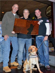 Charlie Kapp, Joseph Sguera and Glen Moody pose for a photo with a steel sculpture made by Kapp. Photo from the Help Glen Bring Indy Home fundraiser