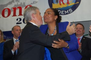 Suffolk County Executive Steve Bellone and Brookhaven Councilwoman Valerie Cartright go in for a kiss after both win re-election. Photo by Rohma Abbas