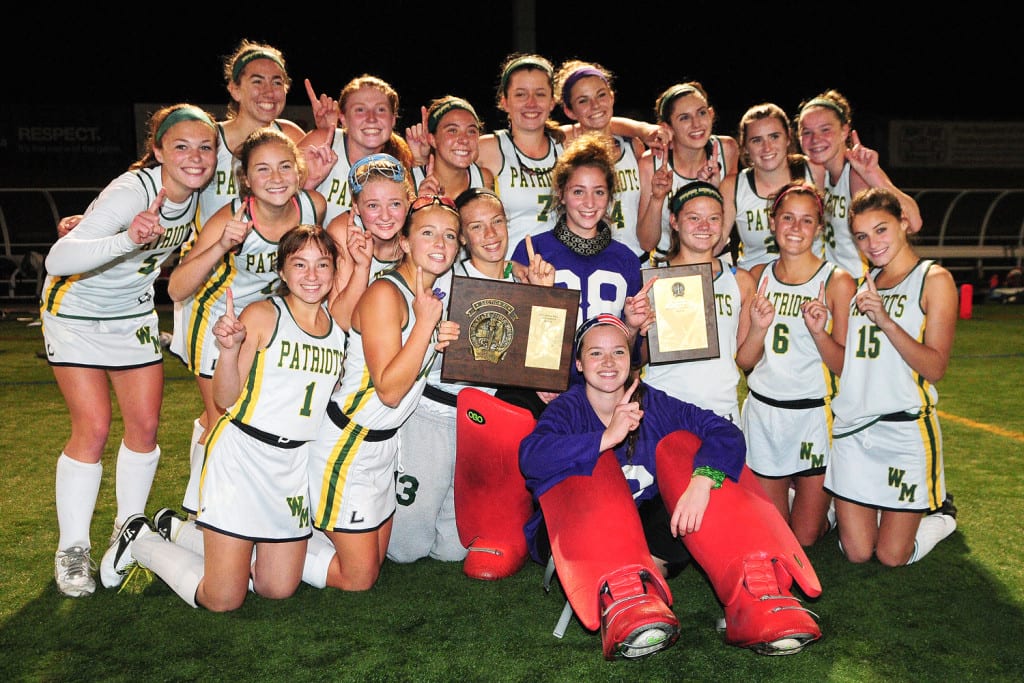 The Ward Melville field hockey team poses for a group photo after edging out Newfield, 2-1, to earn the Suffolk County Class A title at Dowling College on Nov. 2. Photo by Bill Landon