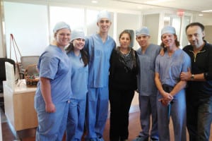 The medical team that took care of Uerda Zena, including Dr. Levchuck second from right, surrounds mom Barbara Zena. Photo from Debbie Engelhardt