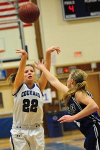 Center each junior Cassidy Treanor shoots the ball in a game last season. File photo by Bill Landon