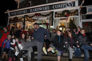 Northport residents dance to Christmas music before the leg lamp-lighting at Northport Hardware Co. Photo by Victoria Espinoza