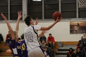Port Jefferson senior Michael Spyrou goes for the layup in the Royals' 60-58 win over Greenport on Dec. 18. Photo by Desirée Keegan