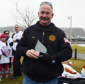 Tom Meehan participates in the Royal Educational Foundation’s fun run through Port Jefferson Village, and receives an award for his contributions to the community. File photo