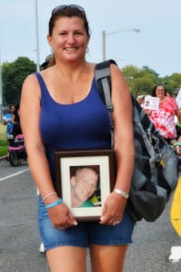 Tracey Budd holds a picture of her son, Kevin Norris, at a Walk for Hope event. Photo from Tracey Budd