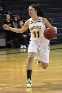 Ward Melville junior Brook Pikiell dribbles the ball up the court in the Patriots' 55-49 nonleague win over Islip on Dec. 12. Photo by Desirée Keegan