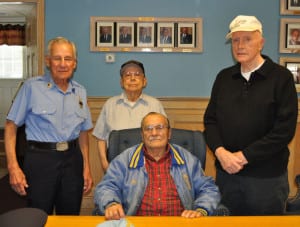 Fred Gumbus, James Newcomb, Walter Baldelli and Hugh Campbell, at the Port Jefferson firehouse, talk about the toughest and most memorable calls they went on in their many years with the department. Photo by Elana Glowatz