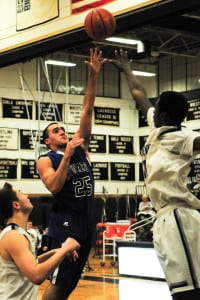 Centereach's Jake Marzocca shoots in the Cougars' 61-35 loss to Huntington on Jan. 5. Photo by Bill Landon