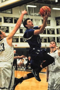 Centereach's Kevin Callahan scores in the Blue Devils' Jan. 5 61-35 loss to Huntington. Photo by Bill Landon