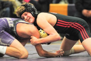 Mount Sinai eighth-grader Matt Campo, who is controlling his opponent, improved his record to 24-1 after pinning his Sayville competitor at 99 pounds on Jan. 22. The Mustangs improved to 6-1 in League VI to end the season in a three-way tie for first place with their 62-15 win over the Golden Flashes. Photo by Bill Landon