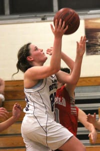 Port Jefferson's Courtney Lewis reaches up to the board. Photo by Desirée Keegan