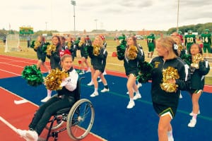The Ward Melville cheerleading team performs on the sidelines of a football game. Photo from Loren Quitoni 