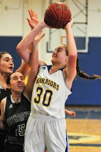 Junior forward Samantha Collins reached for the rim. Photo by Bill Landon