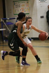 Taylor Tripptree dribbles around an opponent. Photo by Desirée Keegan