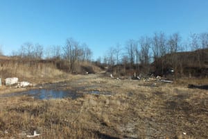 The former Steck-Philbin Landfill on Old Northport Road in Kings Park is one of the eight blighted brownfields that the Suffolk County Landbank requested proposals for repurposing. Image from Suffolk County Landbank Corp.