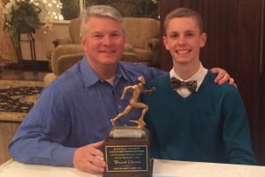 Daniel Claxton and his father Bill pose for a photo with his Most Outstanding Athlete Award. Photo from Daniel Claxton