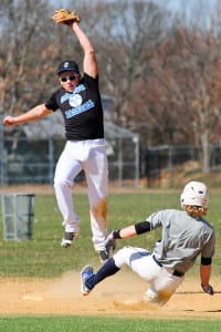 Matt Traube snags the ball up high for the tag at second base. Photo by Bill Landon