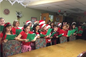 The Mount Sinai Community Service and Outreach Club sings holiday carols at a local nursing home. Photo from Lindsey Ferraro