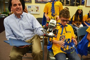 Steven Nielsen shows off the creation of the Robotic Raccoons, Comsewogue's middle school team. Photo by Alex Petroski