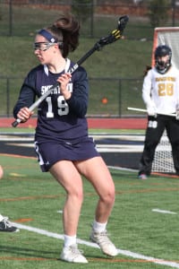 Smithtown West sophomore Grace Langella wins up to pass the ball. Photo by Desirée Keegan
